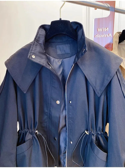 Chic, vintage, and effortlessly cool — meet the Vintage Seoul Crop Trench.